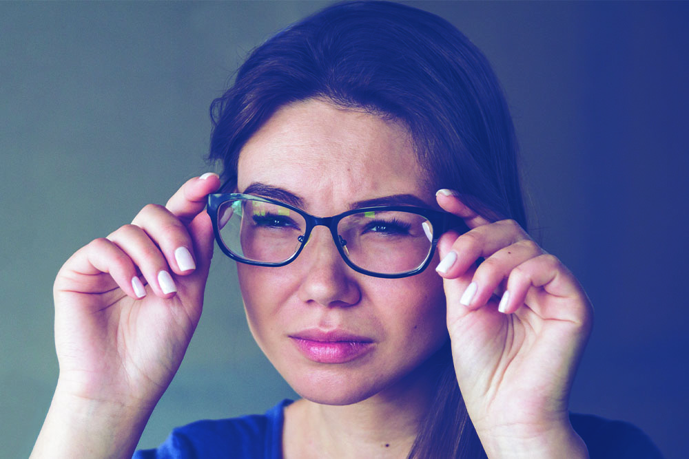 A woman with astigmatism wearing glasses